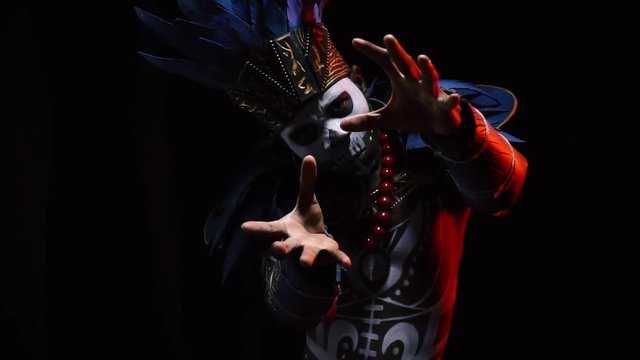 Face of a shaman with a skull