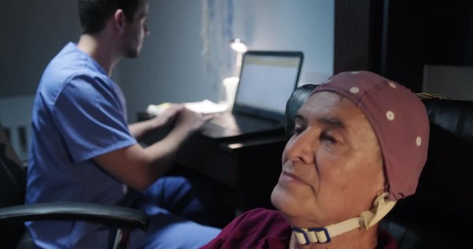 EEG Test on an Elderly Man at Hospital Laboratory