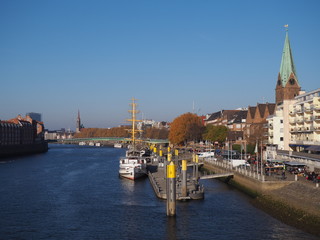 Bremen, Germany - View of the river Weser and the historic Schlachte waterfront with the spire of...