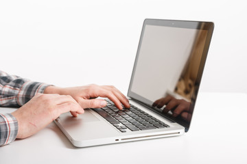 Fototapeta na wymiar Laptop with man hand isolated