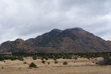 scenic view of Granite Mountain, a popular hiking trail destination in Prescott, Arizona, with clearing storm clouds