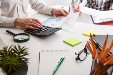 Business concept. Two business mans working and meeting with chart at office on his desk.