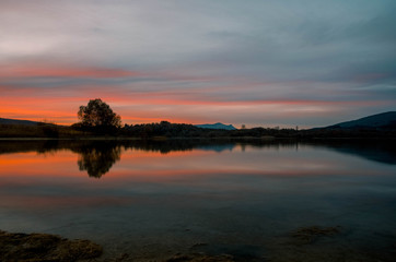 Fototapeta na wymiar Sunset in the Ullibarri-Gamboa reservoir. Alava, Basque Country, Spain