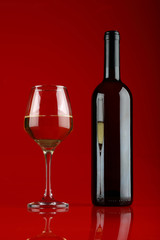 Glass and bottle of white wine