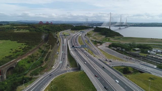 Aerial view of busy intersection leading towards the Queensferry Crossing and Forth bridges near Edinburgh, infrastructure and transportation in Scotland, Europe