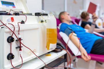 People giving blood in a modern hospital