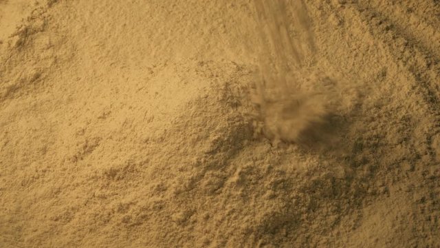 Spice Powder Pours Into Pile