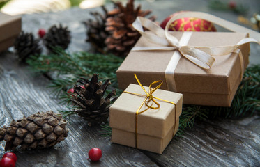 Naklejka na ściany i meble Christmas gift boxes on a rustic wooden background