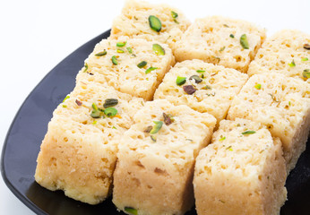 Indian Traditional Famous Sweet Food Mysore Pak or Mysoor Pak Isolated on White Background