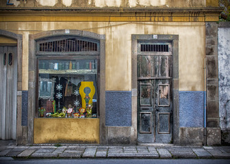 Fototapeta na wymiar Old Storefront With Unique Items, Braga, Portugal