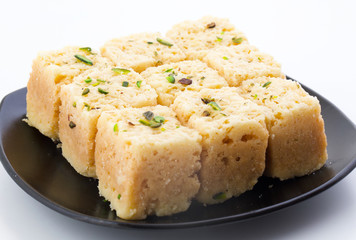Indian Traditional Famous Sweet Food Mysore Pak or Mysoor Pak Isolated on White Background