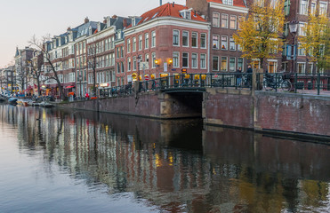 Obraz premium Amsterdam, Netherlands - main city and capital of the country, Amsterdam offers a splendid display of history and modernity, surrounded by the unique view of its canals