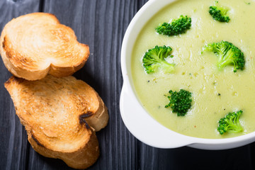 Fresh broccoli cream soup in bowl