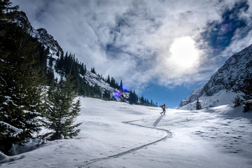 Fototapeta na wymiar Two men skiing in Faragas mountains, Southern Carpathians, Romania