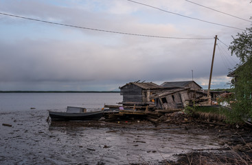 rotten sheds on the shore