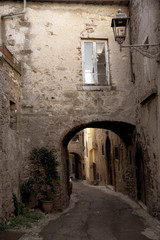 Fototapeta na wymiar characteristic alley of Italian medieval village. Amelia, Umbria, Italy