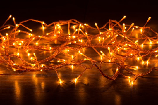 Glowing garland on a wood background