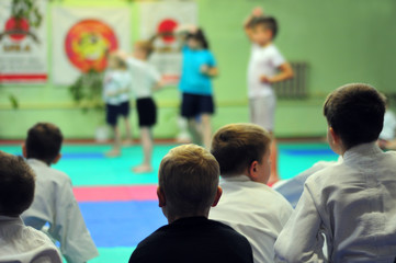 The first exam in karate. Exam for the right to wear a kimono.  For web pages or advertising printing. Persons blurred beyond recognition.