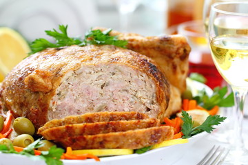 Celebratory food. Baked chicken stuffed with ham and mushrums for festive dinner