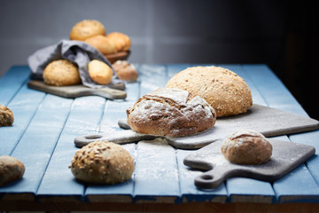 Fresh bread on a blue table in the bakery