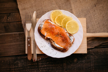 Smoked salmon with cheese toasted bread lemon and yogurt dip