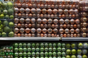 texture of a variety of beautiful large colored christmas balls in a set in transparent packages