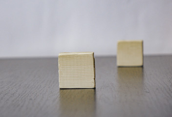 two wooden cubes