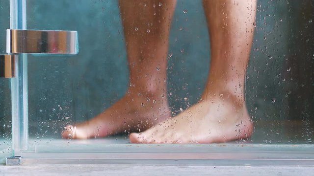 Man taking shower in 4k slow motion 60fps