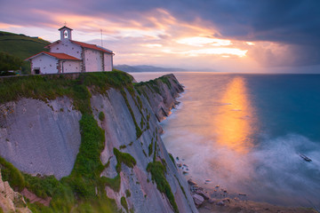 Zumaia's famous ermitage of San Telmo at the top of the cliffs above the basque coast, Basque Country.