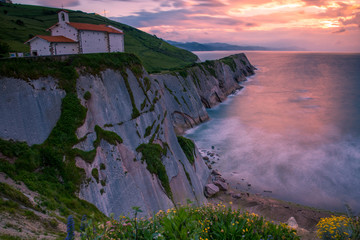 Zumaia's famous ermitage of San Telmo at the top of the cliffs above the basque coast, Basque...