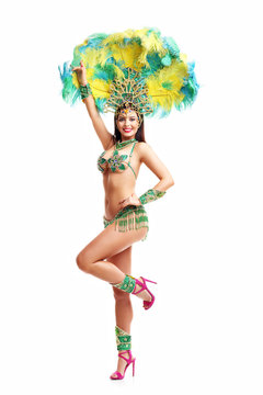 Brazilian woman posing in samba costume over white background