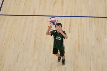Volleyball player setting the ball