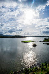 Obraz na płótnie Canvas Pilar dam. Lake water, sun and clouds. Bohol