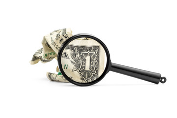 Crumpled one dollar bill with magnifying glass on white.