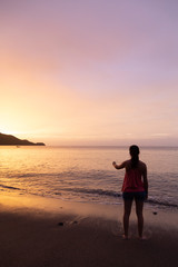 Fototapeta premium girl watching sunset at costa rica beach