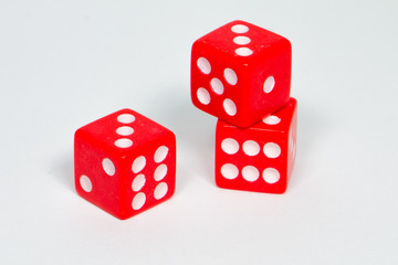 square dice in red on a white background