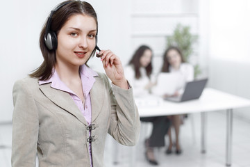 female operator call center in the background of the office.
