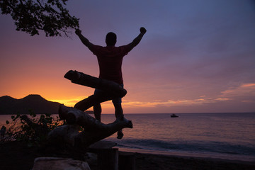 Fototapeta premium man watching sunset at costa rica beach