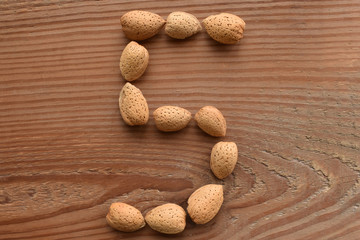 the number 5 shaped with almonds