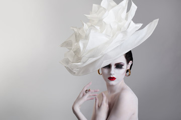 Portrait of a young woman with a hat