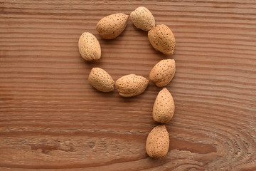 the number 9 shaped with almonds