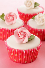 PINK FLOWER CUPCAKE  CLOSE UP FOOD IMAGE