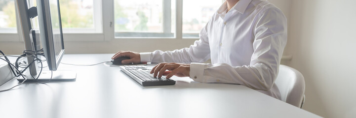 Student or programmer sitting at his desk working