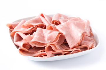 Mortadella slices on white plate isolated on white background. Close up