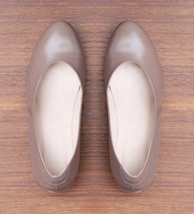 Brown shoes on wooden background