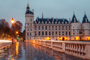Fototapeta na wymiar Morning view of the castle of the Conciergerie in Paris in the rain
