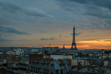view of eiffel tower and roofs of paris