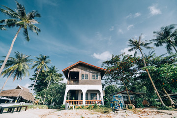 Tropical landscape at sunrise. guest house on the beach