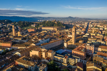 Fototapeta premium Morning aerial panorama of Cesena in Emilia Romagna Italy near Forli and Rimini, with medieval Malatestiana castle, Piazza del Popolo and Roman Catholic churches and cathedral