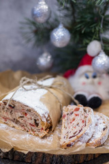 Traditional Stollen in the section on the background of Christmas tree